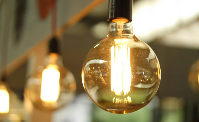 Warm glow of bulbs in brighton coworking office space